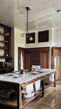 an old kitchen with wooden cabinets and marble counter tops, is pictured in this image