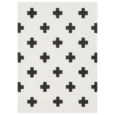 a black and white rug with crosses on the front, in various sizes and colors