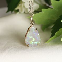 "Pear cabochon shaped beautiful Australian opal pendant necklace. It's featured on 14k yellow solid gold handmade prong setting, diamond bail and 14k yellow solid gold chain. Opal is pear shaped cab cut and unique. DETAILS  Opal is genuine Australian opal and pear shaped. Pendant size : 21.5mm height, 14.5mm width Bails has 3 diamonds total 0.01 ct.  It's coming with 16' to 18\" adjustable 14k solid gold chain.  All our raw materials are sourced from US-based companies for the quality and safety Opal Cabochon Yellow Gold Jewelry, Yellow Gold Opal Cabochon Jewelry, Elegant Ethiopian Opal Jewelry With Cabochon, Elegant Ethiopian Opal Cabochon Jewelry, Formal Opal Gemstone Jewelry, Formal Ethiopian Opal Cabochon Jewelry, Yellow Gold Opal Teardrop Pendant Necklace, Yellow Gold Teardrop Opal Necklace, Oval Opal Necklace For Anniversary