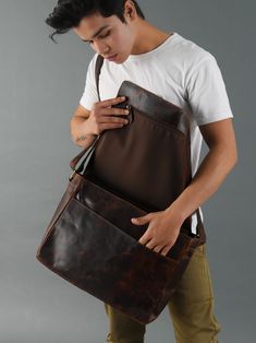 Trustpilot Picking the right everyday work bag is as essential as your work, and Kayden Messenger bag caters to it the best. The handcrafted laptop bag is spacious, comes with an adjustable shoulder strap, and is made with premium buffalo leather Salient Features Size : 16L x 12H x 4.5D Inch Made from buffalo leather Color- Brown High-quality brass hardware and YKK zippers. Adjustable shoulder strap to add ease of carrying Multiple compartments to stay organized Handcrafted by skilled Indian cra Everyday Carry Satchel Laptop Bag With Leather Handles, Leather Satchel Laptop Bag For Everyday Carry, Luxury Satchel Laptop Bag With Leather Handles, Luxury Satchel Laptop Bag With Leather Handles For Everyday, Leather Satchel With Laptop Sleeve For Everyday, Leather Shoulder Bag With Laptop Sleeve, Leather Shoulder Bag With Laptop Sleeve For Everyday, Leather Laptop Bag With Sleeve For Everyday Carry, Travel Shoulder Bag With Adjustable Strap In Oiled Leather