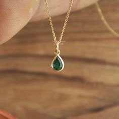 Handcrafted Pear Cut Emerald Pendant Necklace - Minimalist Lab Grown Gemstone Jewelry. Elegant Minimalist Lab Grown Emerald Pendant Necklace - Pear Cut Gemstone Jewelry Gemstone ✦ 𝗟𝗮𝗯 𝗚𝗿𝗼𝘄𝗻 / 𝗖𝗿𝗲𝗮𝘁𝗲𝗱 𝗘𝗺𝗲𝗿𝗮𝗹𝗱 - 𝗠𝗮𝗻 - 𝗠𝗮𝗱𝗲 ✦ Pear Cut -  ✦ Color -Green ✦ Excellent / Very Good Cut - Size (mm) : 3/4 mm (approx) ✦ Setting :  Bezel ✦ Bail -  3 mm Diameter Inside ✦ READY TO SHIP - GIFTS ✦ ( ONLY CHARM - PENDANT - SELECT CHAIN as per order ) Metal  ✦ Made of recycled 𝗦𝗼𝗹𝗶𝗱 𝗚𝗼𝗹𝗱 - Nickel free - 14k (585) ✦ Color - Yellow Gold - (as per order)  ✦ Weight-  0.400 Grams (Gold weight will vary as per order / Metal purity) ✦ Condition ➠ Brand New, Never been Used ✦ Send a message for Ring in Platinum Pt950 / ✦ Ring Available in Platinum Pt950 ✦ Stamp/Hallmark: Yes Con Teardrop Emerald Gemstone Necklace For Wedding, Dainty 14k Gold Emerald Necklace For Anniversary, Dainty Yellow Gold Emerald Necklace For Anniversary, Teardrop Emerald Necklace For Wedding, Teardrop Emerald Wedding Necklace, Wedding Teardrop Emerald Necklace, Emerald Necklace In Yellow Gold For Weddings, Gold Emerald Birthstone Necklace For Wedding, Yellow Gold Emerald Necklace For Wedding