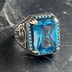 Handmade Square Blue Aquamarine Gemstone Silver Ring , The Flamboyant Eagle Ring , Animal Figural Ring , 925 Sterling Silver Ring , Gift For Him , Same Day For Shipping ✧ Product Details * Handmade İtem * Gender : Male / Female * Material : 925K Sterling Silver * Ring Weight : 11.5 Grams * Gemstone Type : Blue Aquamarine ✔ Usage Details * Silver jewelry is very sensitive to chemicals. It is recommended to keep away from chemical substances such as cream, bleach, deodorant, detergent. * Silver je Eagle Ring, Aquamarine Gemstone, Aquamarine Blue, Ring Collections, Rings Statement, 925 Sterling Silver Ring, Gift For Him, Ring Gift, Sterling Silver Ring