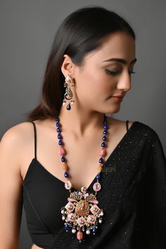 Antique Polish Fusion Party Wear Indian Ethnic Jewellery Set With Earrings, Long Indian Pendant Necklace Set, Jadau Jaipuri Jewellery This beautiful piece is an absolute show-stealer. It features meenakari motifs combined with tinch of Kundan and temple work. The strings are strewn with blue semi-precious stones.  PRODUCT DETAIL: * Necklace Length: 24 inches (comes with adjustable Lock) * Earrings Length: 2.75 inches approx * Material: Brass and stone * Package: Necklace and Earring STYLE TIP: This beautiful piece is made for a modern-day lady who has her heart in the little details of her heritage. A perfect fit for sarees and ethnic dresses ABOUT US: Jaipri makes each piece of its product by learning techniques and crafts from deep down in the local markets and villages. We use Indian ra Multicolor Beaded Temple Jewelry Earrings, Traditional Jewelry Sets With Dangling Beads For Celebration, Traditional Jewelry With Dangling Beads For Celebration, Bohemian Temple Necklace With Meenakari Chandbali, Motif Jewelry For Party And Festivals, Bohemian Beaded Danglers For Festive Occasions, Festive Multicolor Beaded Necklace With Latkans, Festival Party Jewelry With Motifs, Festive Party Jewelry With Motifs