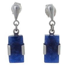 Leslie Granthon treasures the deep blue glow of sodalite in the chic design of these earrings. The minimalist earrings are crafted by hand with sterling silver for a harmonious contrast. Blue Polished Drop Earrings, Blue Drop Earrings With Polished Finish, Modern Sapphire Sterling Silver Earrings, Modern Sapphire Gemstone Earrings, Modern Blue Earrings With Natural Stones, Hand Rings, Blue Glow, Sterling Pendant, Unique Bracelets