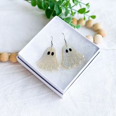 Embrace the spooky season in style with our Ghost Earrings! This whimsical Halloween Jewelry makes a fun and charming statement, perfect for adding a touch of holiday spirit to your everyday attire. Handcrafted with love, these earrings are more than just Ghost Jewelry - they're wearable pieces of art that add a playful, festive vibe. These Ghost Dangle Earrings are an ideal Fun Gift for a Teacher who loves to express her style and personality. They're also the perfect Birthday Gift for a Friend who appreciates unique, handcrafted jewelry and the fun of Halloween. Stand out from the crowd and make a Spooky Statement with our playful Ghost Earrings! We care about your comfort as much as your style. Our Ghost Earrings feature Surgical Steel posts, making them safe for Sensitive Ears and comf Halloween Earrings Polymer Clay, Cute Clay Earrings, Birthday Gift For Friend, Jewelry Polymer Clay, Whimsical Halloween, Ghost Earrings, Cute Clay, Earrings Cute, Halloween Earrings