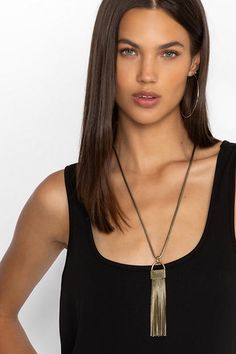 Creating a sense of elegance and style, the Tassel Drop Necklace is equal parts versatile and fun. Featuring strands of brass-tone metal suspended as a pendant, this timeless necklace can be worn with casual and elevated styles. Pair with the Tassel Drop Earrings for a perfectly coordinated look. Women's Tassel Pendant Necklace by Johnny Was in Brass Gold-tone Brass Necklace With Detachable Pendant, Brass Pendant Chain Necklace, Gold-tone Necklace With Large Pendant, Modern Brass Necklace With Delicate Chain, Gold-tone Metal Charm Necklaces, Gold-tone Brass Jewelry With Detachable Pendant, Gold Brass Necklace With Detachable Pendant, Brass Jewelry With Large Pendant, Elegant Brass Charm Necklace With Large Pendant