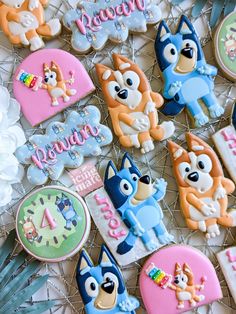 some decorated cookies are sitting on a table