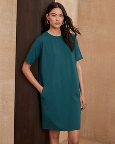 EILEEN FISHER Organic-Cotton Jersey Round-Neck Dress Chic Knee-length Dresses With Cuffed Sleeves, Knee-length Cuffed Sleeves Workwear Dress, Knee-length Daywear Dresses With Rolled Sleeves, Knee-length Dresses With Rolled Sleeves For Daywear, Knee-length Business Casual Dresses With Pockets, Elegant Dresses With Rolled Sleeves, Elegant Knee-length Dresses With Rolled Sleeves, Knee-length Dresses With Rolled Sleeves For Fall, Relaxed Fit Dresses With Cuffed Sleeves