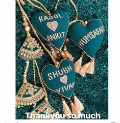 three blue heart shaped ornaments with tassels hanging from the sides and words that say, thank you so much