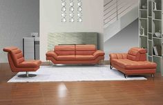 an orange couch and chair in a living room