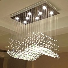 a chandelier hanging from the ceiling in a room