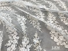 High quality embroidery lace This fabric is perfect  for Wedding  Bridal Dress,Evening gown,Cocktail dress and some others.  It is very gorgeous high quality fabric. ★Materials * High quality Bridal Embroidery lace * Primary fabric: Tulle * Secondary fabric: Embroidery lace * Color: Off White   ★MEASUREMENTS * Price is set for 1 yard(=91.44cm).   You will receive the fabric in one continuous piece if you purchase more than 1 yard. * Width : Mesh : 60~61 inch (152~154cm)               Embroidered Elegant Off White Embroidered Fabric For Wedding, Elegant Embroidered White Tulle Fabric, Elegant White Embroidered Tulle Fabric, Elegant White Embroidered Fabric With Scalloped Lace, Elegant Embroidered Fabric With Scalloped Lace For Wedding, Elegant Lace Embroidered Fabric For Wedding, White Embroidered Fabric With Delicate Lace For Ceremony, Elegant White Tulle Fabric For Ceremony, Elegant Crochet Lace Tulle Fabric For Wedding