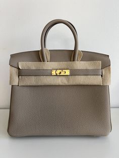 Hermès Birkin 25 Gris Tourterelle Togo With Gold Hardware Birkin 30 Etoupe, Birkin 30 Gold, Hermes Birkin 25 Ostrich, Hermes Birkin 30 Gold Togo, Hermes Special Order Birkin, Rich Girl Aesthetic, Hermes Birkin 25, Best Handbags, Hermes Bag