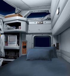 there is a bed in the back of an airplane that has been converted into a sleeping quarters