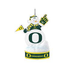 an ornament with the letter o on it and a snowman holding a flag