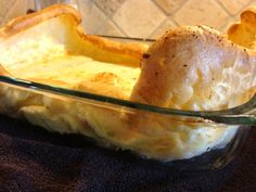 a glass casserole dish with bread in it