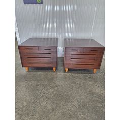 two wooden drawers sitting next to each other