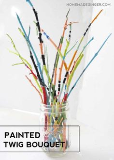 a vase filled with lots of colorful paint sticks in it's bottom and the words painted twig bouquet above it