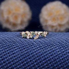 a close up of a ring on a blue cloth