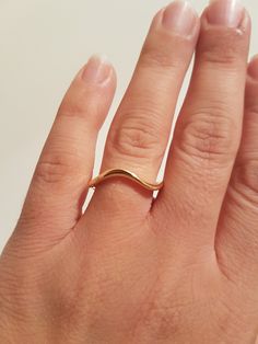 Wave wedding band in 14k solid gold. This ring designed to be timeless and worn forever. Perfect as a wedding band, great gift for yourself or special someone. This ring is smooth and fits your everyday with its comfortable fit. ♥ Measurements: Ring width is approx 3.5 mm at the top and 2.5 mm at the bottom. The ring is about 3 mm thick at the top (height above the finger) and 2 mm at the bottom. ♥ Material: Available in white / yellow / rose gold (100% genuine 14k solid gold). The ring made to Minimalist Curved Wedding Rings, Curved 14k Gold Jewelry For Anniversary, Gold Infinity Stackable Rings For Wedding, Curved Gold Rings For Gifts, 14k Gold Curved Jewelry For Anniversary, Gold Curved Rings For Gifts, Gold Curved Rings For Gift, Modern Twist 14k Gold Wedding Bands, Modern Twist Gold Wedding Rings