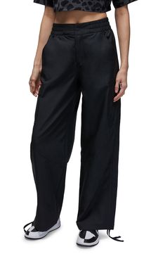 These lightweight cargo pants in a slightly cropped length with ankle ties are a go-anywhere fave. 32" inseam; 13" leg opening; 13 1/2" front rise; 16 1/2" back rise (size XXL) Elastic/snap waist Front slant pockets Adjustable tie hems 100% polyester Machine wash, tumble dry Imported Nordstrom x Nike: A curated lifestyle destination where fashion is the ultimate sport Chicago Women, Nike Air Women, Jordan Chicago, Running Trousers, Graphic Leggings, Current Fashion Trends, Romper With Skirt, Pants Black, Running Women