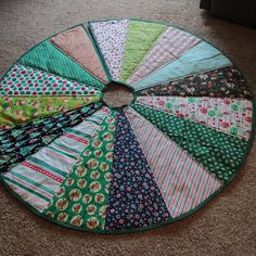 a circular patchwork quilt on the floor