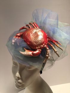 Sea food Festival- Crab Festival - Crab Hat- Beach Headpiece- Wedding - Shell headband- Beach headpiece- Mermaid costume Hello, This fascinator can be worn at a beach wedding, birthday, Derby or for a mermaid costume. It's made with a plastic Crab. It is 2 inches high and diameter is 7 inches wide. One of a kind...each one is a little different. Netting is shown in blues like water but can be in other colors....just ask. It's crab is finished with a metallic gold dusting so make it sparkle a bit Red Crab, Large Brim Hat, Derby Horse, Types Of Hats, Mermaid Costume, Sea Food, Headpiece Wedding, Fascinator Hats, A Mermaid