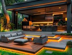 an outdoor living area with couches and lights