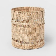 a woven basket with holes in the middle