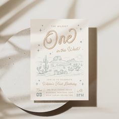 a white plate with a one in the west birthday card on it's side