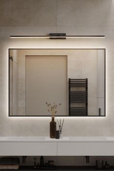 a bathroom with a sink, mirror and towel rack