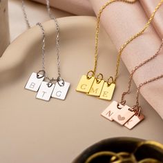 Add a personal touch with our Personalized Gold Initial Tag Necklace. Featuring customizable initial tags, this necklace is available in gold, silver, and rose gold. Handcrafted with care, it adds elegance to any outfit. Perfect for birthdays, anniversaries, or daily wear, this piece is a timeless keepsake and a stylish addition to any collection. Celebrate special moments or show someone you care with this unique necklace. Make it uniquely yours or gift it to someone special today! - Material: 925 Sterling Silver or 14k Solid Gold - Dimensions: 8 x 10 mm - Finish: 14k Gold, 14k Rose Gold, 14k White Gold - Unless "Solid Gold" option is chosen from the "Finish" dropdown menu, your jewelry will be 14k gold plated over 925 sterling silver. - Each piece of our jewelry is unique and lovingly ha Initial Tag Necklace, Letter Pendant Necklace, Women Gifts, Gold Initial, Unique Necklace, Necklace Women, Letter Pendants, Personalized Initials, Initial Pendant