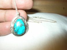 "Up for your consideration is this Beautiful Vintage Sterling Necklace Pendant. Pendant has a beautiful turquoise. Measurements are Approximately Pendant 1 1/8\" by 3/8\". Necklace is Approximately 17 1/2\". I have tested this pendant and Necklace with acid and they are Guaranteed to be Sterling. I did not find any damage to it, this is a great find being offered at a reasonable price.E-Mail me with any questions you have prior to purchase. Pictures best describe item. Reasonably Priced." Collectible Teardrop Turquoise Jewelry, Untreated Turquoise Pendant Necklace Collectible, Untreated Turquoise Pendant Necklace For Collectors, Collectible Engraved Turquoise Necklace, Collectible Turquoise Necklace With Round Pendant, Collector's Turquoise Necklace With Round Pendant, Collectible Turquoise Round Pendant Necklace, Collectible Round Turquoise Necklace, Halloween Choker