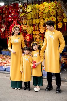 Family matching Traditional Vietnamese Ao Dai. Mom and daughters include ao dai and pants. Dad and boys only have Ao Dai. Very well made with high-quality Velvet fabric. Hand embroidery This set includes the Ao Dai and pants with no headband. It's Asian Size, it may run out 1-2 size smaller than international size.  Please see size chart for measurements of available pre-made sizes. Please provide your chest and waist measurement when placing your order so we can ensure the best fit for you. Ple Festive Long Sleeve Ao Dai For Traditional Ceremonies, Traditional Long Sleeve Ao Dai For Festive Occasions, Spring Long Sleeve Sets For Traditional Ceremonies, Traditional Festive Ao Dai With Stand Collar, Festive Long Sleeve Matching Set Dress, Yellow Long Sleeve Traditional Wear For Spring, Traditional Yellow Ao Dai, Yellow Fitted Traditional Ao Dai, Spring Festive Embroidered Ao Dai