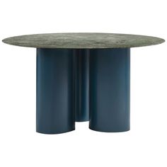 a round table with two blue pedestals in the shape of three columns on each side