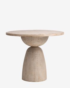 a white table with a wooden base on the top and one leg in the shape of a ball