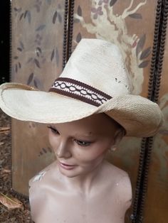 80s stylish light blonde straw cowboy hat with brown fabric trim and hawk feathers made by Cascade hat and Cap Co Inside circumference 22 inches,  height 5.5 inches brim length 15 inches,  brim width 3.5 inches White Straw Hat Bands For Country Events, Country Style White Straw Hat Bands, Western Cream Straw Hat With Short Brim, Cream Western Straw Hat With Short Brim, Western Style Cream Straw Hat With Short Brim, Cream Western Toquilla Straw Hat, Cream Toquilla Straw Western Hat, Western Style Natural Straw Hat For Kentucky Derby, Western Cream Straw Hat For Rodeo