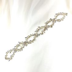 This delicate bridal hair vine is finished with a glamorous luster and fine detailing. Its shimmering structure intertwined with illuminating crystals is sure to make this piece a head turner as it glows and frames your gorgeous wedding look. Use it in the front or back of an updo, around a bun, and many other ways. Available in all crystal or crystal and pearl, and comes in silver or gold. -Genuine crystals -Approximately 1.5in at the widest point x 14in long (3.8cm x 35.6cm) -Rhodium or gold p Adjustable Crystal Embellished Hair Accessories For Weddings, Gold Crystal Embellished Headpieces For Wedding, Elegant Crystal Embellished Jewelry Headband, Elegant Adjustable Hair Accessories For Ceremony, Adjustable Crystal Embellished Headpieces For Wedding, Elegant Adjustable Bridal Accessories, Elegant Adjustable Jewelry For Ceremonies, Adjustable Bridal Belt For Wedding, Elegant Headband Hair Accessories For Ceremony