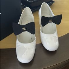 These Gorgeous Chanel Shoes Add So Much To An Outfit!! The Double C’s Are On Each Bow There Are Two Places On The Heels That Are Slightly Worn Off. Otherwise They Are In Great Condition!!!! Chanel Shoes Heels, Black Bows, The Double, Shoes White, Chanel Shoes, Black Bow, Shoes Women Heels, Color White, Chanel