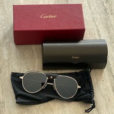 New With Packaging Cartier Men’s Sunglasses. Metal Titanium Material With A Brushed Ruthenium Finish, Gray Polarized Lenses. Ruthenium Finish, Aviator Shape. Black Calfskin Bridge *Please Note: Model Pic Is In Different Color Than What It For Sale But Same Look Luxury Cartier Sunglasses With Tinted Lenses, Classic Cartier Sunglasses For Formal Occasions, Classic Cartier Sunglasses With Tinted Lenses, Classic Cartier Sunglasses With Gradient Lenses, Classic Cartier Sunglasses With Mirrored Lenses, Classic Cartier Tinted Sunglasses, Formal Cartier Sunglasses With Gradient Lenses, Modern Cartier Sunglasses For Formal Occasions, Classic Formal Sunglasses With Metal Frame