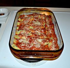 a casserole dish is sitting on top of the stove