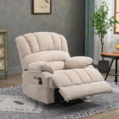 a beige recliner sitting on top of a rug