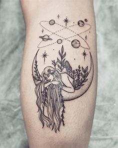 a woman's thigh with an image of the moon and stars above her head