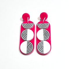 Channel your inner retro diva with these earrings inspired by the iconic Go-Go era. The lively colors and swinging design capture the spirit of fun. Created in hot pink and white acrylic, these earrings are 2 7/8" tall, the dangle is 2 1/4" long. They have stainless steel ear posts. Colorful Retro Earrings For Gifts, Retro Pink Party Earrings, Handmade Retro Pink Earrings, Retro Multicolor Hand Painted Earrings, Summer Multicolor Novelty Earrings, Go Go Girl, Go Girl, Acrylic Jewellery, Setting Spray