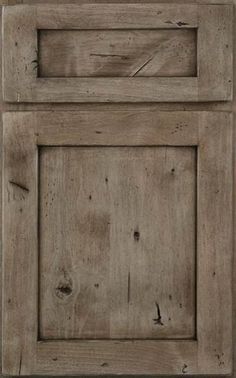 an old wooden cabinet door with nails on it