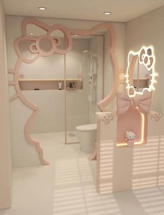 the bathroom is decorated in pink and white with hello kitty decorations on the mirror above the toilet