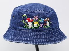 Item: mushroom embroidered bucket hat Material: 100% cotton Size: one size fits most for woman Embroidery: hand made with acrylic thread Free first class shipping, upgradable priority mail service. 30 days return policy, feel confident at your purchase! Cotton Bucket Hat With Curved Brim For Festivals, Whimsical Cotton Hats For Spring, Adjustable Cotton Mini Hats Casual Style, Adjustable Casual Cotton Mini Hats, Summer Snapback Hats With Custom Embroidery, Casual Adjustable Cotton Mini Hats, Adjustable Casual Mini Cotton Hats, Whimsical Bucket Hat With Curved Brim For Spring, Custom Embroidered Summer Hats With Adjustable Fit