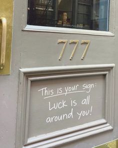 this is your sign luck is all around you written on the door to an apartment