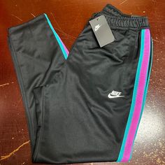 Nike Mens Black Elastic Waist Loose Fit Pockets Tapered Leg Track Pants Size L Brand: Nike Department: Men Size: L Color: Black Type: Pants Style: Track Pants Pattern: Solid Theme: Sports Occasion: Activewear Season: All Season Features: Pockets, Elastic Waist Condition: New With Tags I Offer Discounts For All Return Customers. - Jvs Nike Black Joggers For Streetwear, Black Tapered Sports Pants, Black Tapered Leg Sports Pants, Nike Black Sweatpants With Elastic Waistband, Nike Black Sweatpants For Streetwear, Black Sports Pants With Side Pockets, Nike Streetwear Full-length Pants, Nike Full Length Streetwear Pants, Nike Full Length Pants For Streetwear