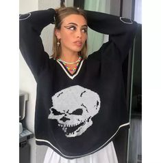 Get ready to make a statement with this women's gothic skull v-neck fall pullover sweater. Featuring a unique skull print and a relaxed fit, this grunge gothic sweater is a must-have for the fashion-forward woman. Crafted from a blend of nylon and acrylic, this sweater is designed for maximum comfort and style. Whether you're looking for a new way to express your gothic style or just need a cozy sweater to keep you warm all season, this pullover is the perfect choice. Get yours now! * made from nylon and acrylic * v-neck loose-fit sweater with a skeleton pattern * yarn thickness: regular yarn * you can style this sweater over a gothic mini dress * complete the look with boots Fall Pullover Sweaters, Cozy Womens Sweaters, Casual Knitwear, Women Sweaters Winter, Loose Pullover, Cardigan Outfits, Winter Sweater, Skull Print, Sweater Women